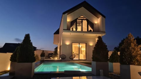 Property building, Patio, Night, Pool view, Swimming pool