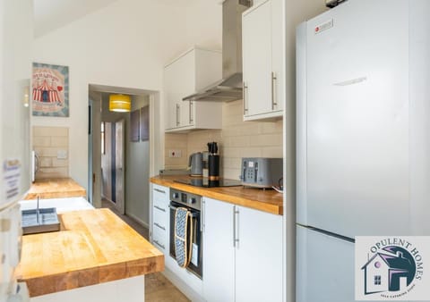 Kitchen or kitchenette, dishwasher, oven, stove, toaster