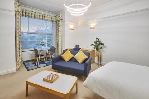 Bed, Living room, Seating area, Dining area, Bedroom