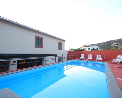 Property building, Living room, Swimming pool