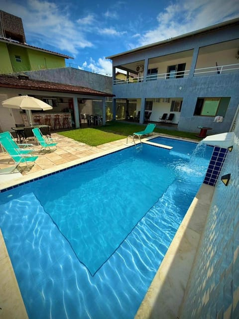 Property building, Patio, Pool view, Swimming pool, sunbed