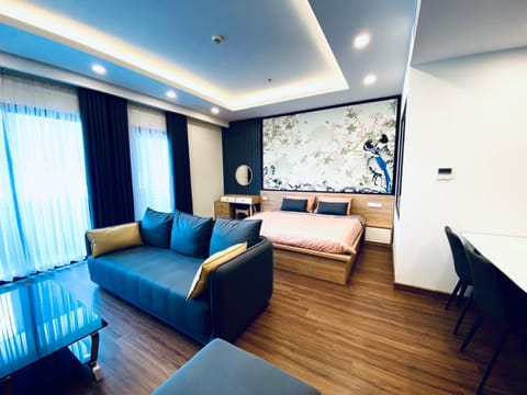 Bed, TV and multimedia, Living room, Seating area, Bedroom