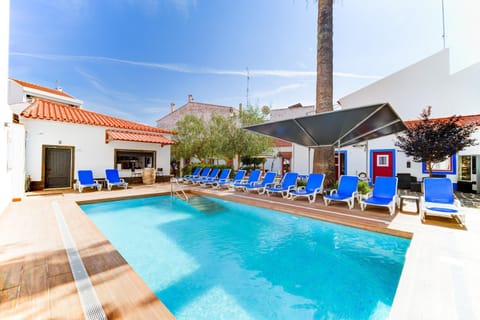 Property building, Patio, Pool view, Swimming pool, sunbed