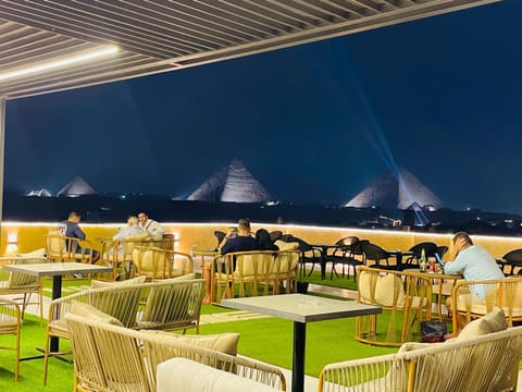 Restaurant/places to eat, Night, Balcony/Terrace, Seating area