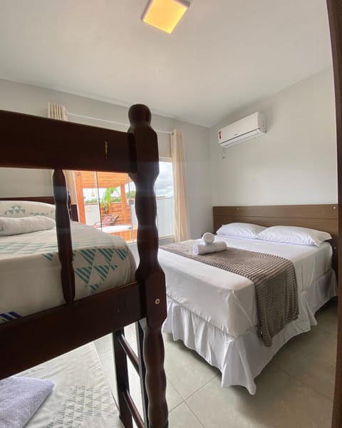 Bed, Photo of the whole room, Bedroom, bunk bed, towels, air conditioner