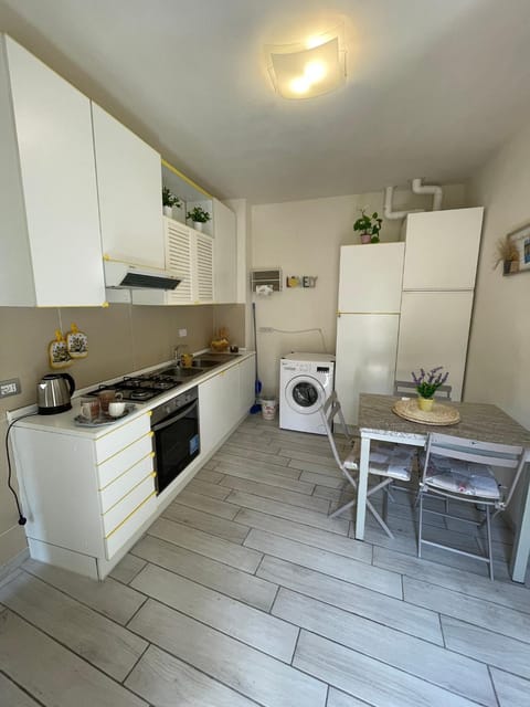 Kitchen or kitchenette, Dining area, oven, stove, washing machine, dryer
