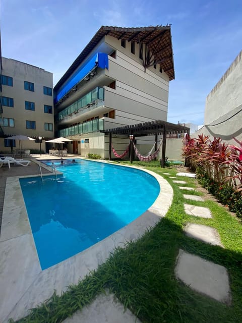 Property building, Pool view, Swimming pool, sunbed