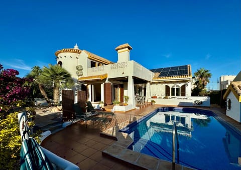 Property building, Patio, BBQ facilities, Pool view, sunbed