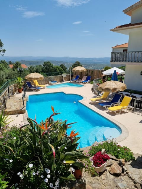 Property building, Patio, Natural landscape, Pool view, Swimming pool