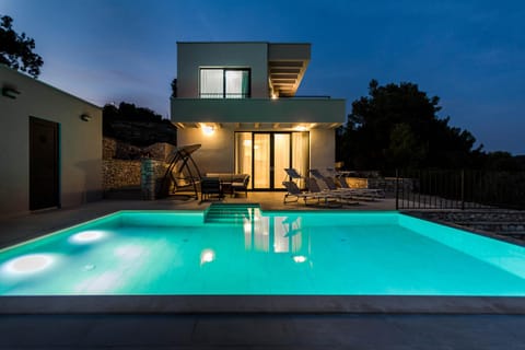 Property building, Patio, Night, Pool view, Swimming pool, sunbed