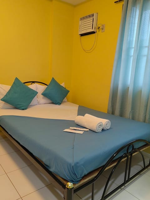 Photo of the whole room, Bedroom, towels, air conditioner