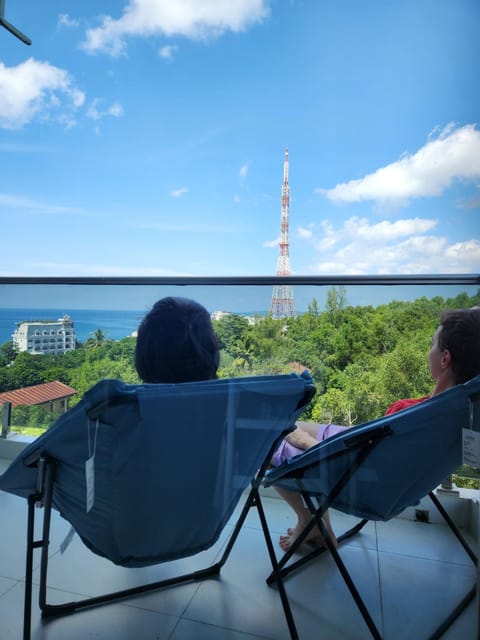 Patio, Day, People, Natural landscape, View (from property/room), Balcony/Terrace, Living room, Seating area, Sea view, group of guests