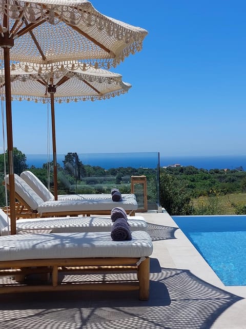 View (from property/room), Mountain view, Sea view, Swimming pool, sunbed