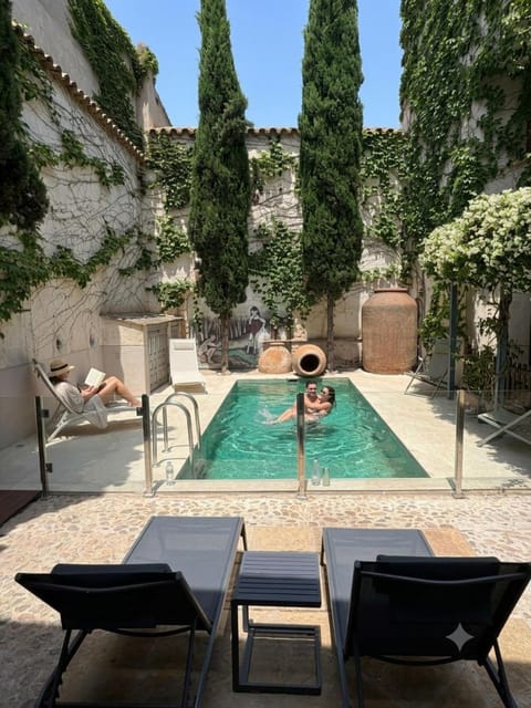 Patio, Day, Pool view, sunbed