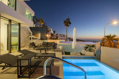 Property building, Patio, Night, Natural landscape, View (from property/room), Balcony/Terrace, Decorative detail, Seating area, City view, City view, Mountain view, Mountain view, Pool view, Pool view, Sea view, Swimming pool, sunbed