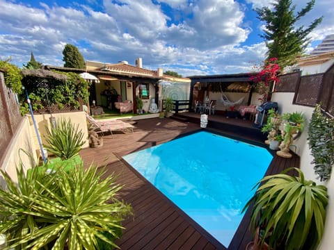 Property building, Garden, Pool view, Swimming pool, sunbed