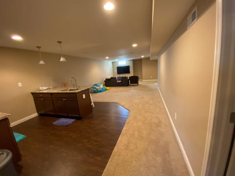 Private basement bedroom with private bathroom, kitchen, and living room with large screen television Vacation rental in Fishers