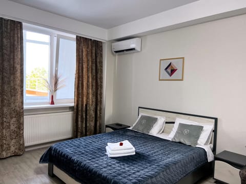 Bed, Photo of the whole room, Bedroom, towels, air conditioner