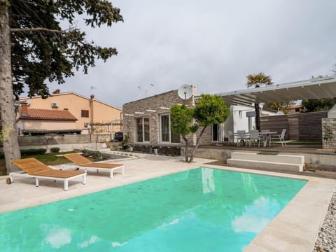 Property building, Patio, Pool view, Swimming pool, sunbed