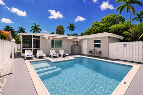 Property building, Patio, Pool view, Swimming pool, sunbed
