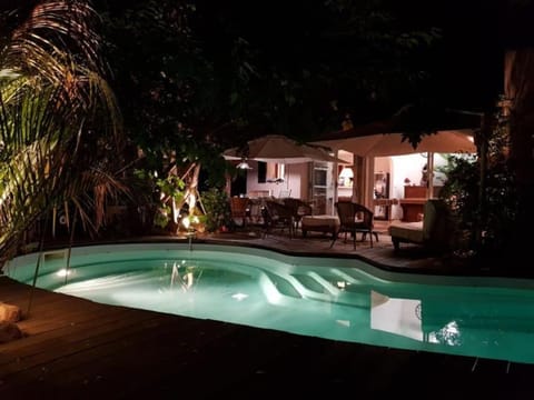 Property building, Patio, Night, Garden, Garden view, Pool view, Swimming pool
