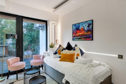 Bed, Living room, Seating area, Bedroom