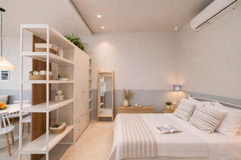 Bed, Living room, Photo of the whole room, Seating area, Bedroom, towels, wardrobe, air conditioner