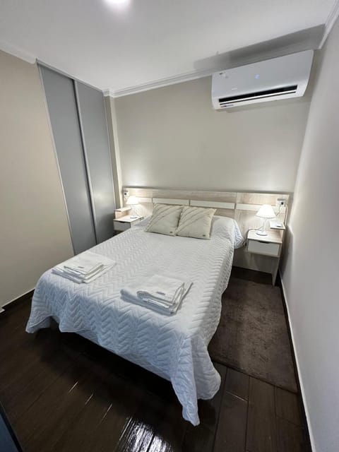 Bed, Photo of the whole room, Bedroom, towels, air conditioner