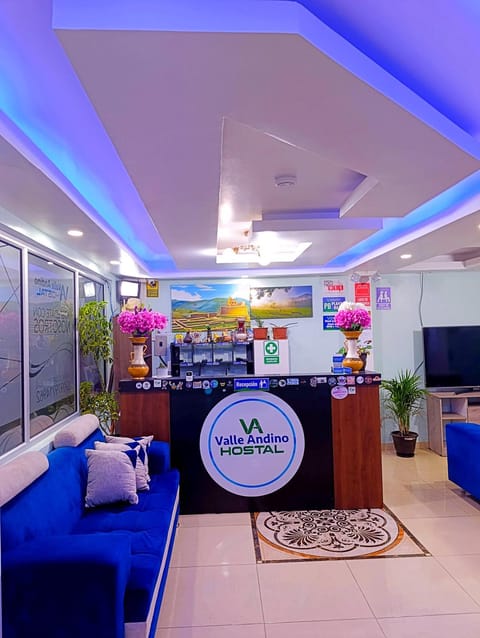 Communal lounge/ TV room, Property logo or sign, TV and multimedia, Living room, Lobby or reception, Seating area, Logo/Certificate/Sign, Certificate/Award