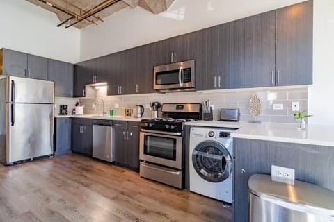 Kitchen or kitchenette, dishwasher, minibar, oven, stove, toaster, washing machine, dryer