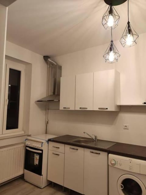 Kitchen or kitchenette, stove, washing machine