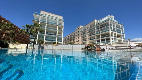 Property building, Day, Pool view, Swimming pool, sunbed