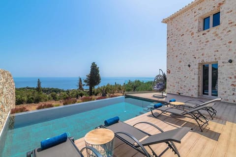 Property building, Patio, Day, Natural landscape, View (from property/room), Balcony/Terrace, Living room, Pool view, Sea view, Swimming pool, sunbed