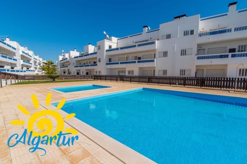 Property building, Day, Property logo or sign, Swimming pool