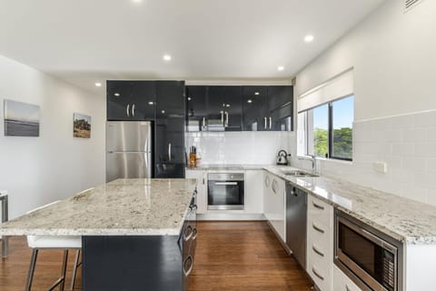 Kitchen or kitchenette, dishwasher, oven, stove, toaster