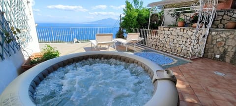Property building, Hot Tub, Balcony/Terrace, Dining area, Sea view, sunbed