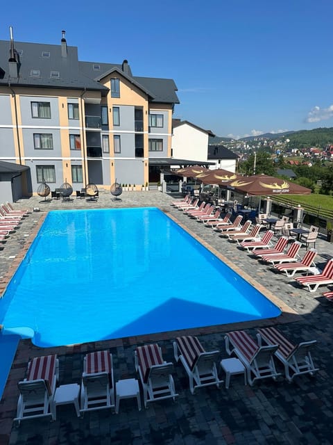 Property building, Natural landscape, Pool view, Swimming pool