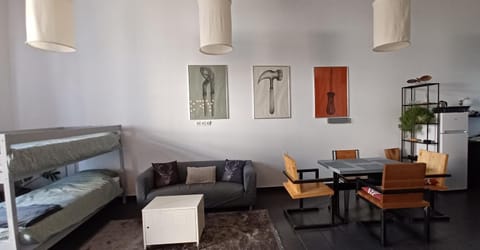 Bed, Living room, Seating area, Dining area