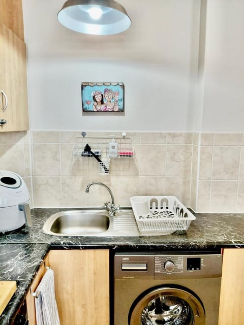 Kitchen or kitchenette, stove, washing machine