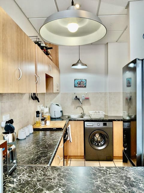 Kitchen or kitchenette, stove, toaster