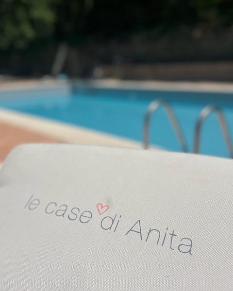 Day, Property logo or sign, Logo/Certificate/Sign, Text overlay, Pool view, Swimming pool, sunbed