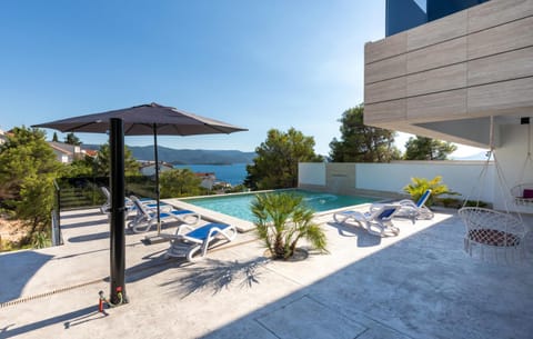 Property building, Patio, Day, Natural landscape, View (from property/room), Balcony/Terrace, Pool view, Sea view, Swimming pool, sunbed