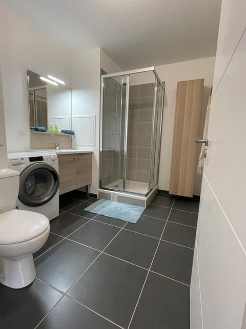 Shower, Toilet, Bathroom, towels, washing machine, dryer