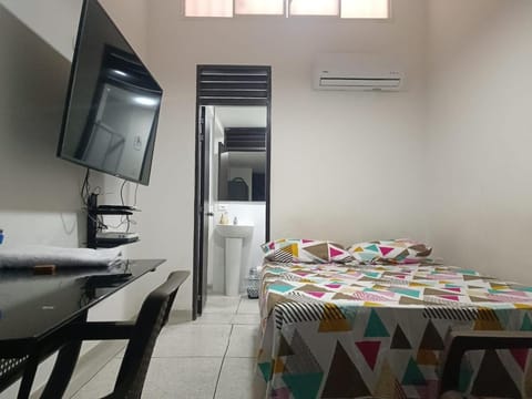 Bed, TV and multimedia, Seating area, Bedroom, air conditioner