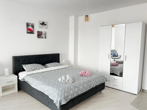 Bed, towels, wardrobe
