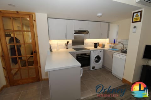 Kitchen or kitchenette, dishwasher, oven, stove, toaster