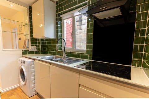 Kitchen or kitchenette, dishwasher, washing machine, dryer