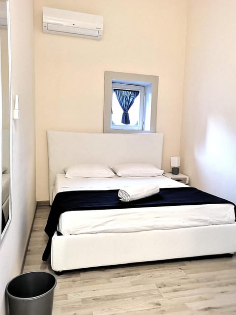 Bed, Photo of the whole room, Bedroom, towels, air conditioner