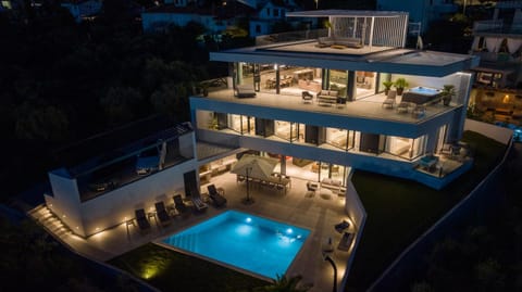 Property building, Patio, Night, Pool view, Swimming pool, sunbed