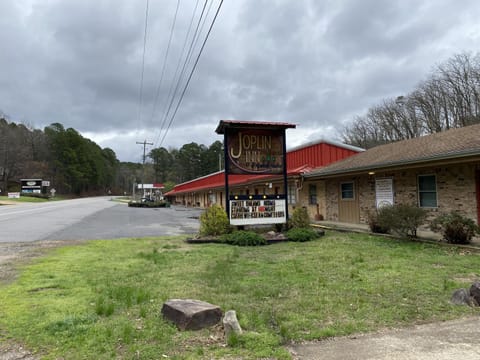 JI9, a Queen Guest Room at the Joplin Inn at entrance to the resort Hotel Room Hotel in Lake Ouachita